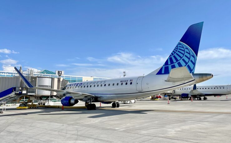 a skywest united express airplane at the gate