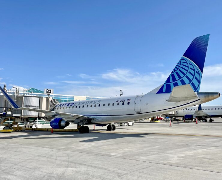 a skywest united express airplane at the gate