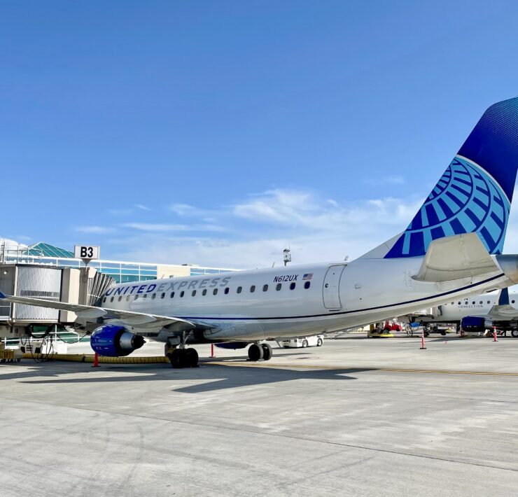a skywest united express airplane at the gate