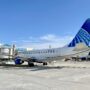 a skywest united express airplane at the gate