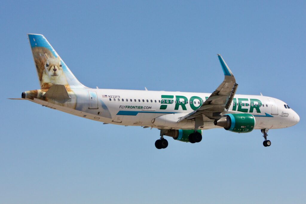 a frontier airlines airbus a320 flying in the sky