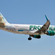 a frontier airlines airbus a320 flying in the sky