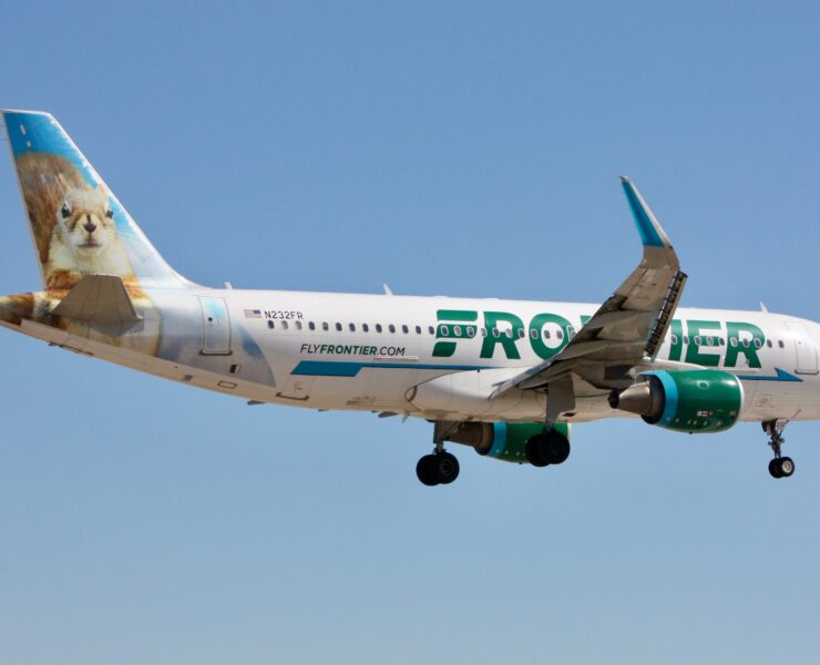 a frontier airlines airbus a320 flying in the sky