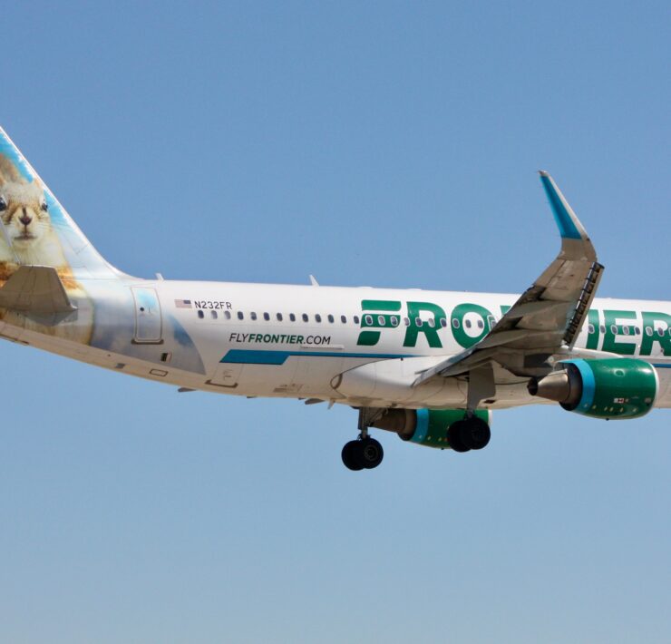 a frontier airlines airbus a320 flying in the sky