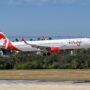 an air canada rouge plane coming into land at tampa airport a plane taking off from a runway