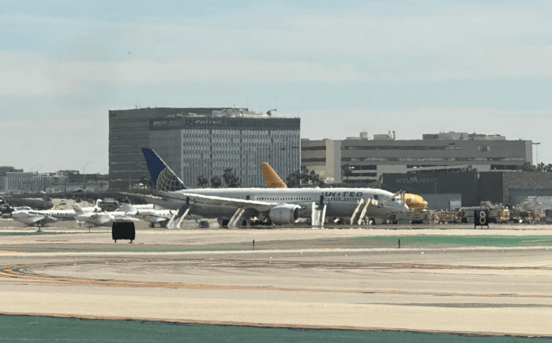 a group of airplanes on a runway