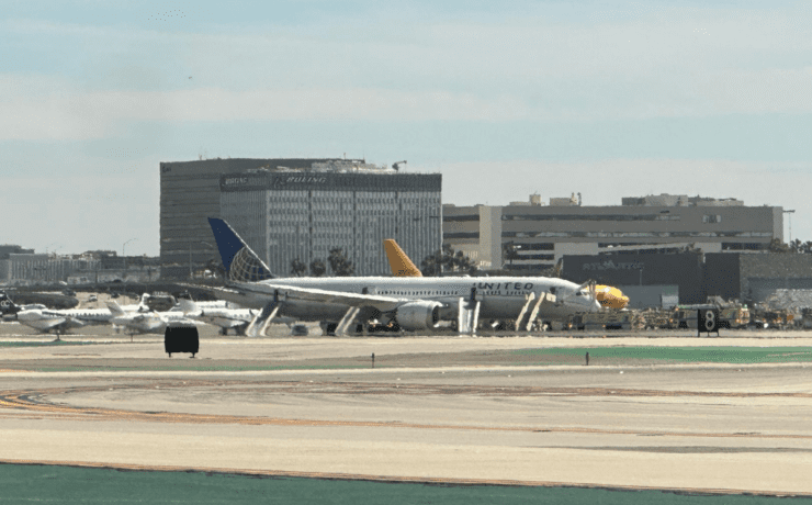 a group of airplanes on a runway