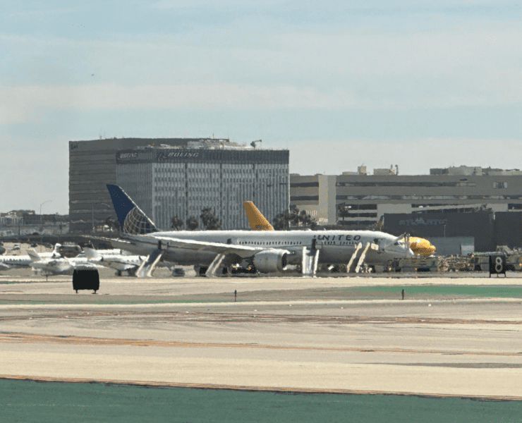 a group of airplanes on a runway