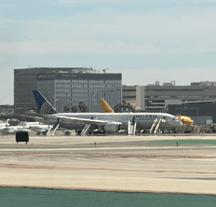 a group of airplanes on a runway