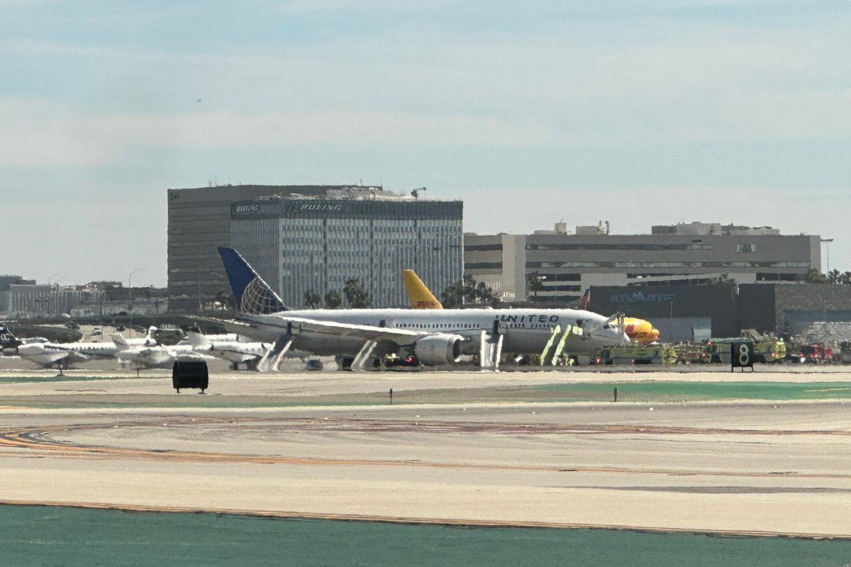 a group of airplanes on a runway