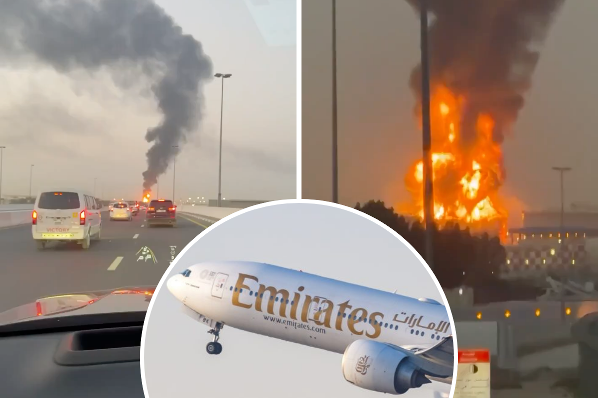 a plane flying over a fire