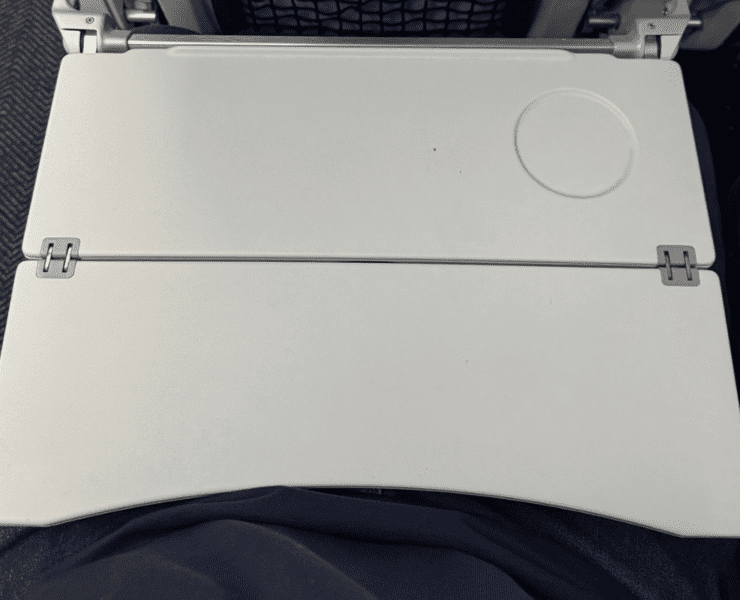 a closr up of a tray table on a united airlines plane