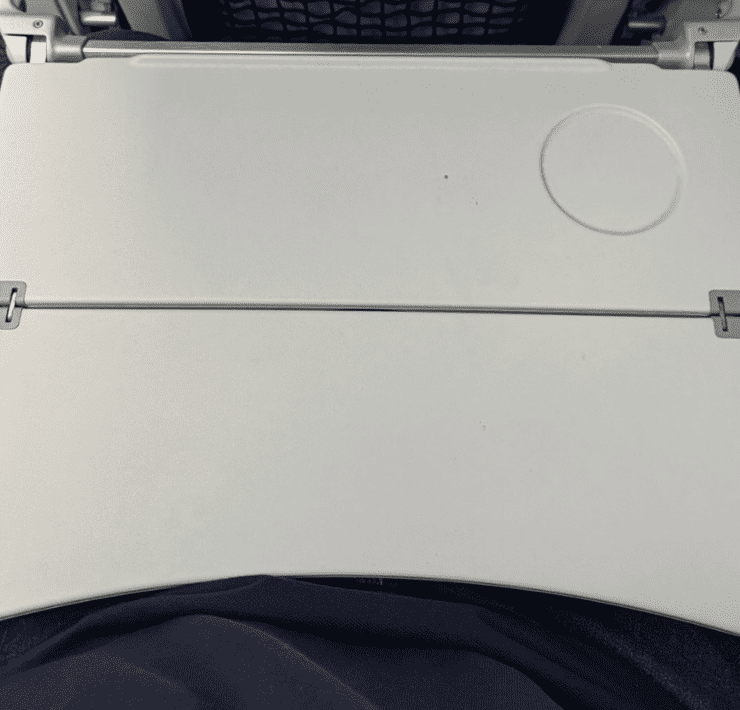 a closr up of a tray table on a united airlines plane