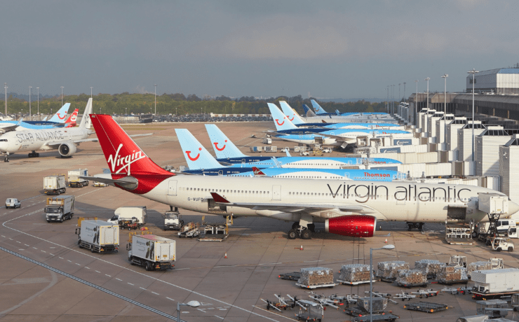 planed lined up at gates at manchester airport