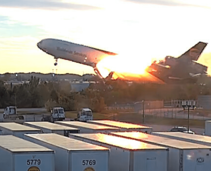 a surveillance video still showing a UPS MD-11 on fire