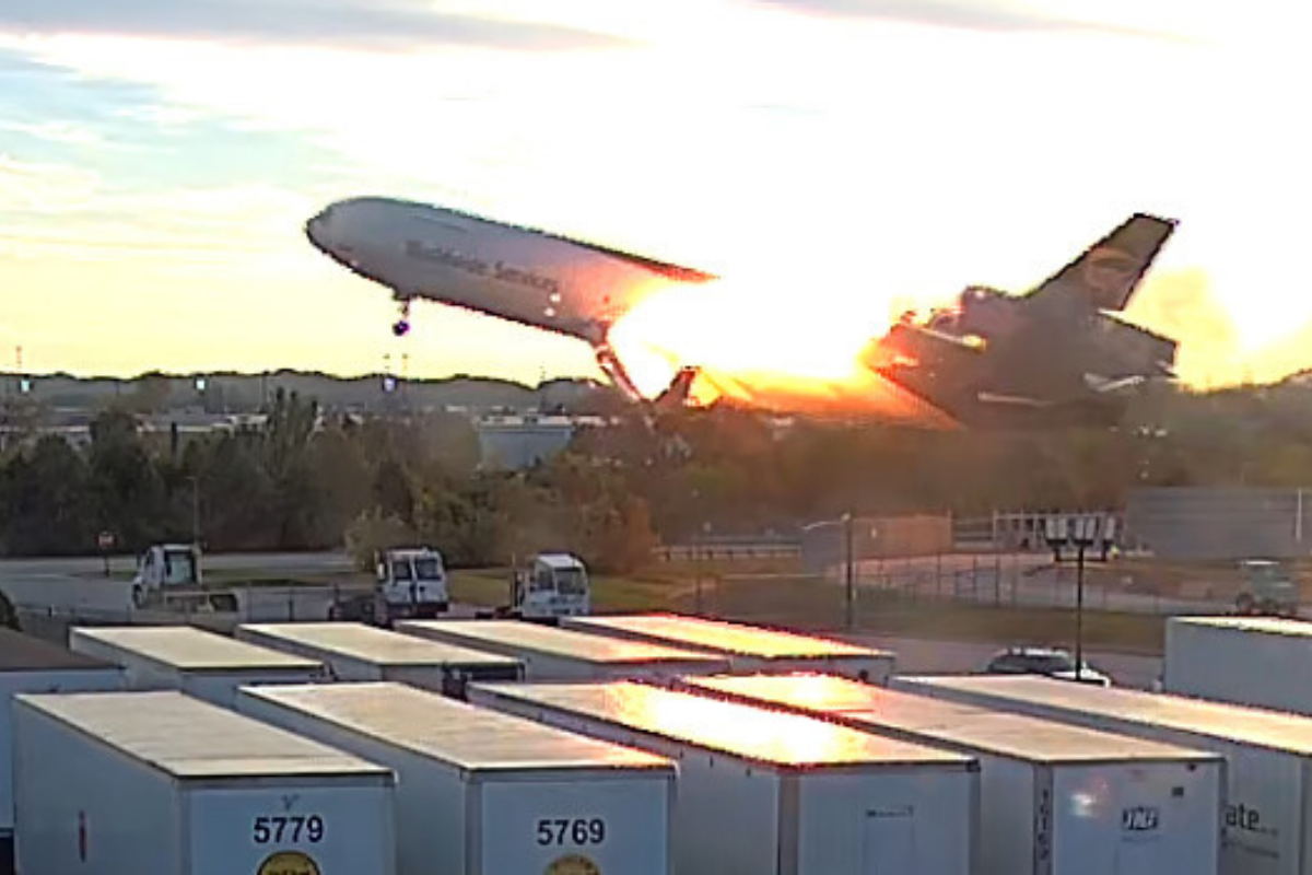 a surveillance video still showing a UPS MD-11 on fire
