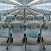 rows of seats in the economy cabin of an emirates airbus a380
