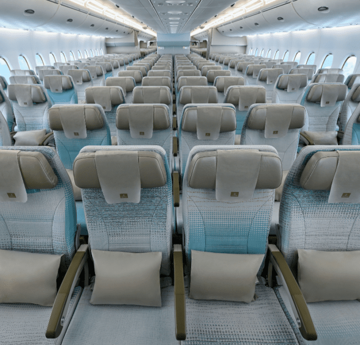 rows of seats in the economy cabin of an emirates airbus a380