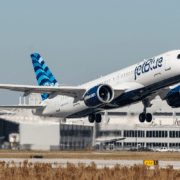 a jetblue a220 taking off