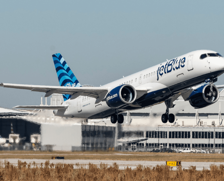 a jetblue a220 taking off