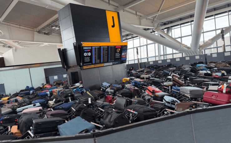mountains luggage pile up in terminal 5 at heathrow airport