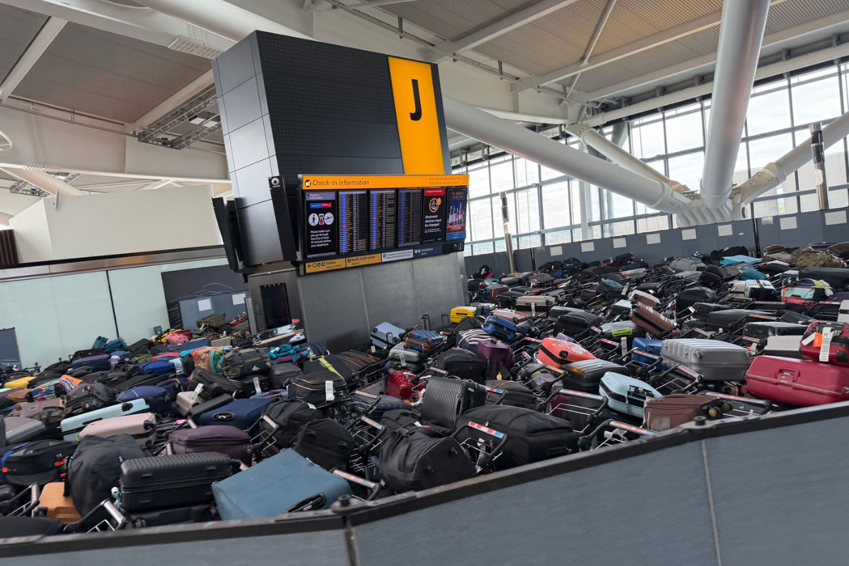 mountains luggage pile up in terminal 5 at heathrow airport