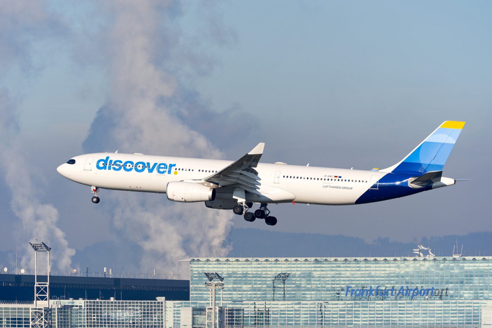 a discover airlines airplane landing at frankfurt airport