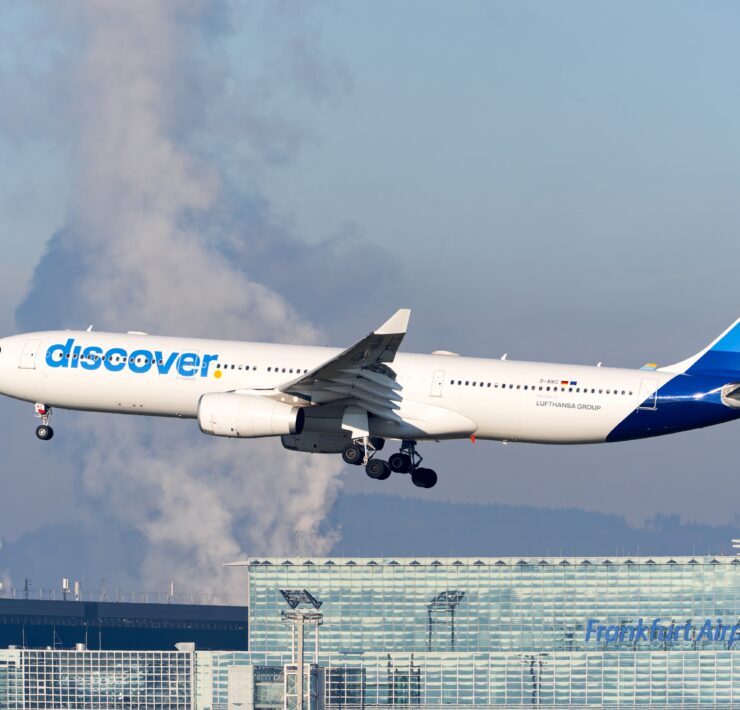 a discover airlines airplane landing at frankfurt airport