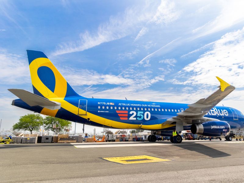 a jetblue aircraft with an American 250 decal