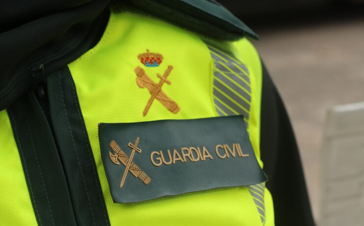 a close up of a guardia civil officer