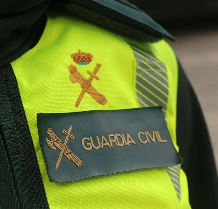 a close up of a guardia civil officer