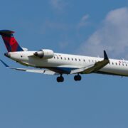 a delta connection airplane flying in the sky