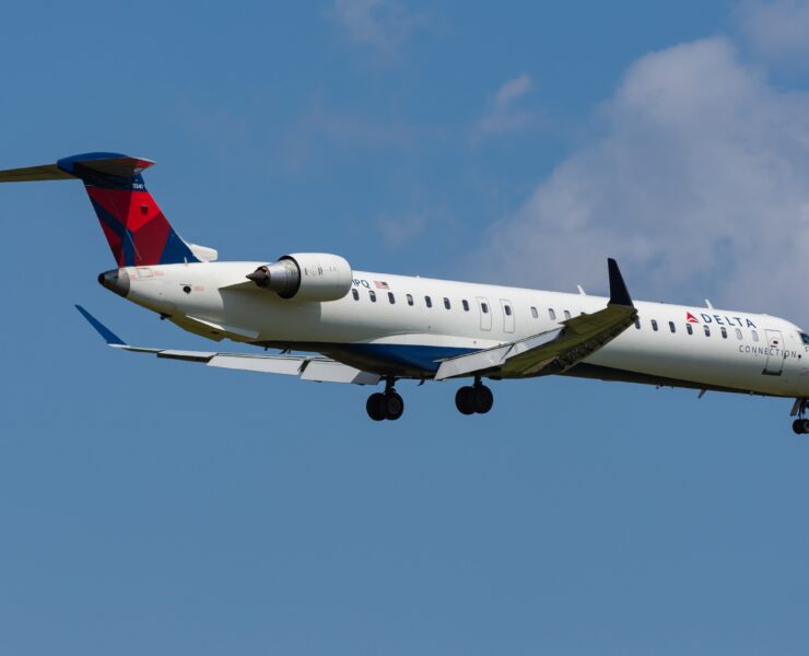 a delta connection airplane flying in the sky