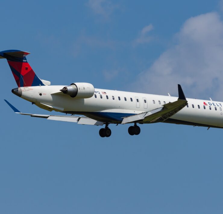 a delta connection airplane flying in the sky