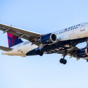 a delta air lines airbus a319 flying in the sky