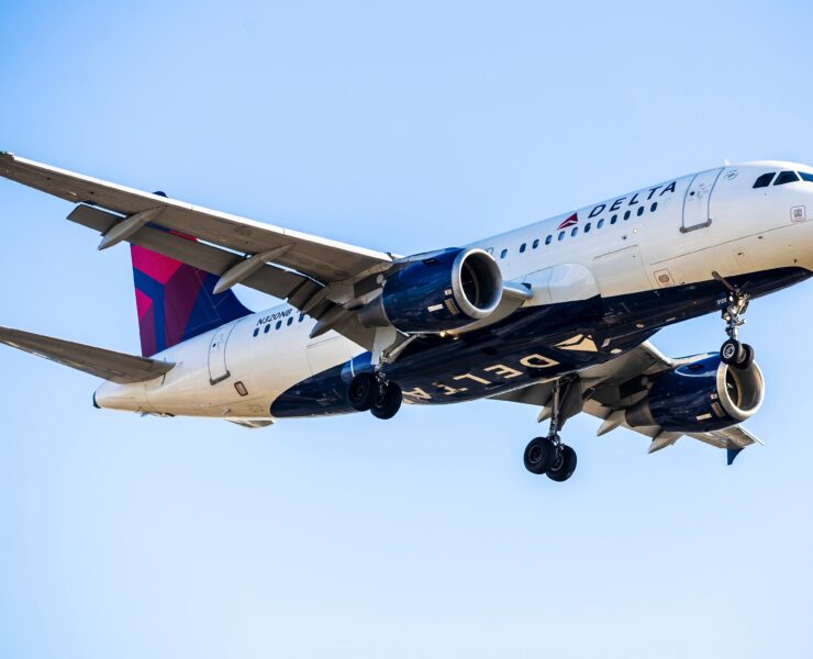 a delta air lines airbus a319 flying in the sky
