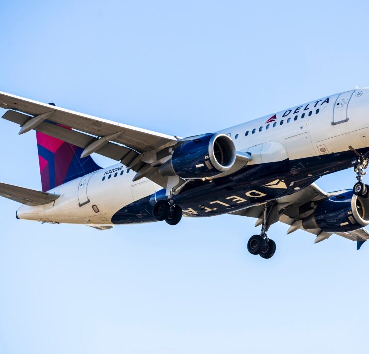 a delta air lines airbus a319 flying in the sky