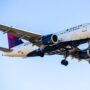 a delta air lines airbus a319 flying in the sky