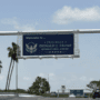 DJT Airport road sign