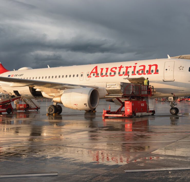 an austrian airlines airbus a320 at the gate