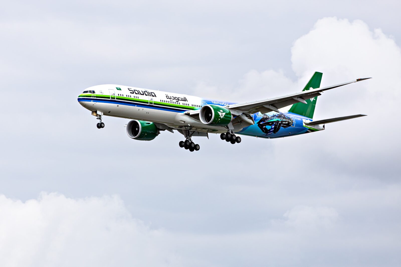 saudia airlines boieng 777 flying in the sky
