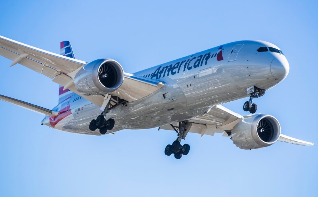 an american airlines boeing 787-9 dreamliner flying in the sky