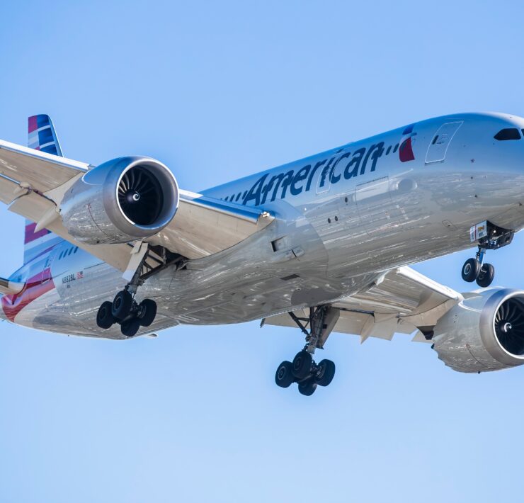 an american airlines boeing 787-9 dreamliner flying in the sky