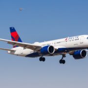 a delta air lines airbus a220 flying in the sky