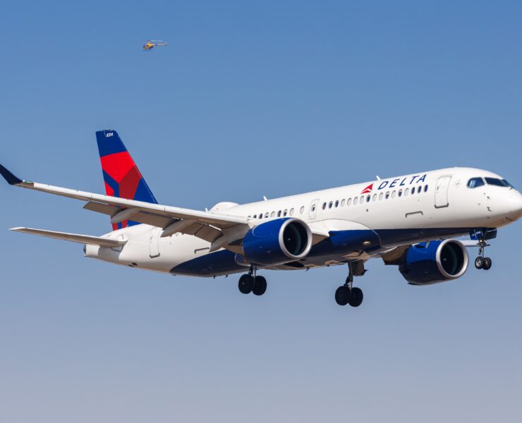 a delta air lines airbus a220 flying in the sky