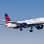 a delta air lines airbus a220 flying in the sky