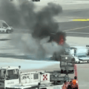 screenshot of video showing a fire in a luggage container at milan malpensa airport
