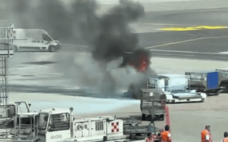 screenshot of video showing a fire in a luggage container at milan malpensa airport