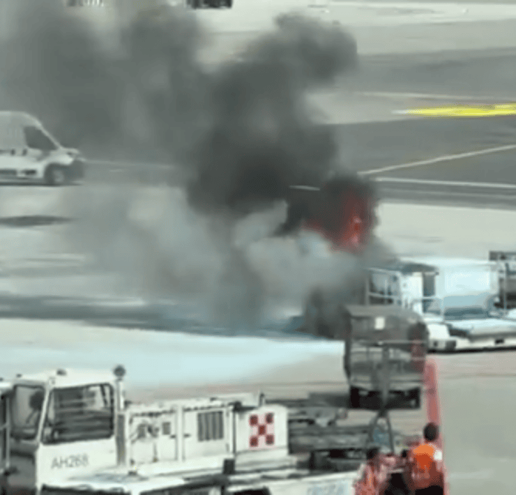 screenshot of video showing a fire in a luggage container at milan malpensa airport