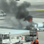 screenshot of video showing a fire in a luggage container at milan malpensa airport